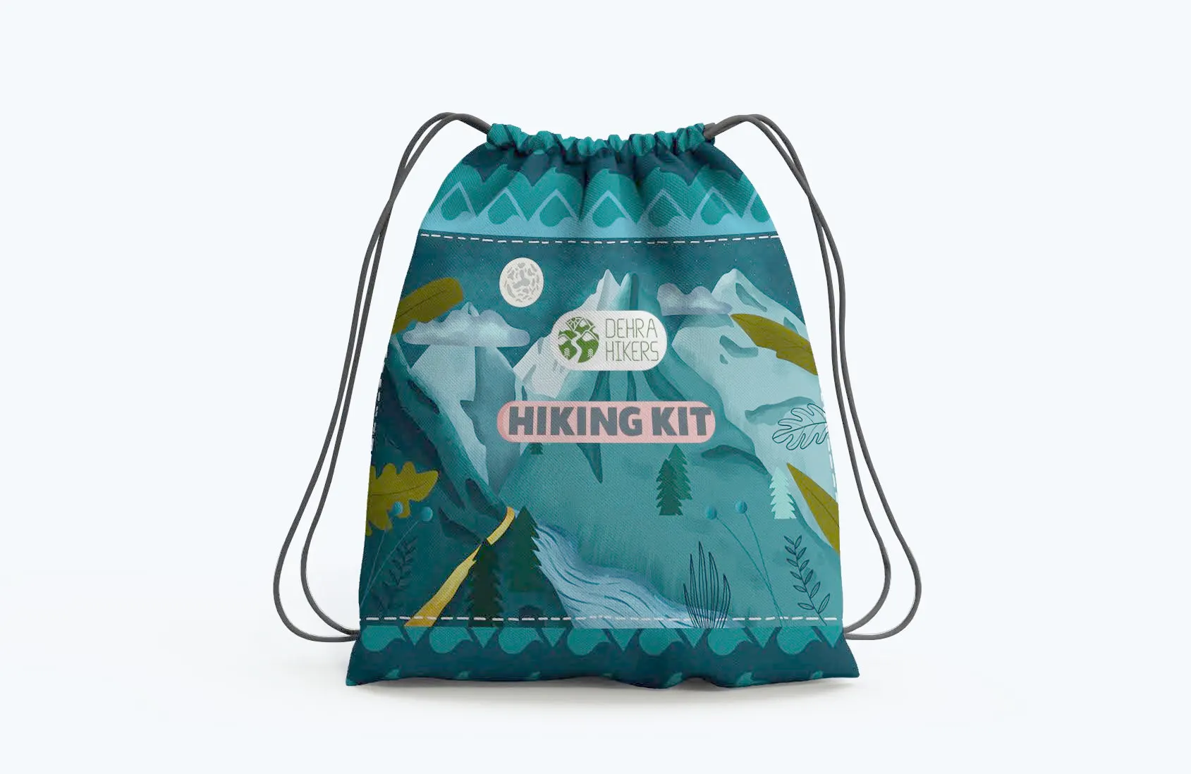 A teal drawstring bag printed with a night mountain scene — snow peaks, a moon, a river, pines and leaves — with the Dehra Hikers roundel on a white pill and the words HIKING KIT in a pink pill beneath it.