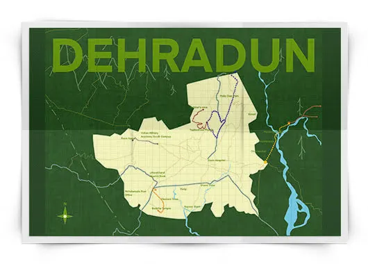 A folded map of Dehradun printed in forest green, with the district outline in cream, rivers in blue, trails in red and orange, and DEHRADUN set large across the top.
